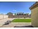 An outdoor space with easy to maintain gravel and synthetic grass at 24035 W La Salle St, Buckeye, AZ 85326