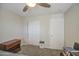 Bedroom features a ceiling fan, a large closet, and a dresser with storage at 24035 W La Salle St, Buckeye, AZ 85326