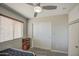 Bedroom features a ceiling fan, window, and closet space at 24035 W La Salle St, Buckeye, AZ 85326
