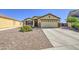 Inviting single-Gathering home features desert landscaping and a spacious two-car garage at 24035 W La Salle St, Buckeye, AZ 85326
