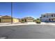 Charming single-Gathering home with desert landscaping, paved driveway and well-maintained lawn at 24035 W La Salle St, Buckeye, AZ 85326
