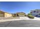 Charming single-Gathering home with desert landscaping, paved driveway and well-maintained lawn at 24035 W La Salle St, Buckeye, AZ 85326