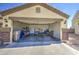 Attached garage with concrete driveway and visible storage space at 24035 W La Salle St, Buckeye, AZ 85326