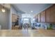 Open-concept kitchen featuring wood cabinets, countertops, and an eat-in dining area at 24035 W La Salle St, Buckeye, AZ 85326