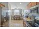 Bright eat-in kitchen featuring stainless steel appliances, tile flooring and light wood cabinets at 24035 W La Salle St, Buckeye, AZ 85326