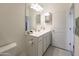 Bathroom featuring a clean white vanity and a well-lit mirror at 2430 E Alonso Dr, Casa Grande, AZ 85194