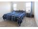 Cozy bedroom with a comfortable bed, soft carpet, and two bright windows at 2430 E Alonso Dr, Casa Grande, AZ 85194