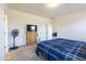 Bedroom with plush carpet and a window, features a large bed and ample space at 2430 E Alonso Dr, Casa Grande, AZ 85194