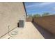 Exterior side view of the property showcasing the HVAC and outdoor space at 2430 E Alonso Dr, Casa Grande, AZ 85194