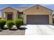 Charming single-story home with a two car garage and low maintenance desert landscaping at 2430 E Alonso Dr, Casa Grande, AZ 85194