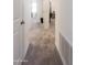 Carpeted hallway showcasing access to other rooms in the house at 2430 E Alonso Dr, Casa Grande, AZ 85194