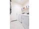 Well-equipped laundry room with modern washer and dryer units, plus convenient overhead shelving at 2430 E Alonso Dr, Casa Grande, AZ 85194