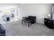 Neutral living room featuring plush carpet and an open floor plan to the kitchen at 2430 E Alonso Dr, Casa Grande, AZ 85194