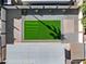 Aerial view of a landscaped backyard features gravel, brick accents, artificial turf, and a shed at 2525 E Nisbet Rd, Phoenix, AZ 85032