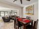 Cozy dining area adjacent to living room with travertine flooring at 2525 E Nisbet Rd, Phoenix, AZ 85032