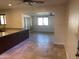 Spacious kitchen featuring neutral walls and stone tile floors throughout at 2525 E Nisbet Rd, Phoenix, AZ 85032