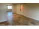 Bright living room featuring neutral walls and stone tile floors at 2525 E Nisbet Rd, Phoenix, AZ 85032