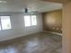 Sunlit living room featuring neutral walls and stone tile floors throughout at 2525 E Nisbet Rd, Phoenix, AZ 85032