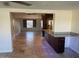 Open-concept living room with natural light and stone tile floors throughout at 2525 E Nisbet Rd, Phoenix, AZ 85032