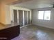 Bright living room area featuring neutral walls and stone tile floors at 2525 E Nisbet Rd, Phoenix, AZ 85032