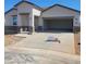 Charming single-story home featuring a spacious two-car garage and modern architectural details at 25489 W Fraktur Rd Rd, Buckeye, AZ 85326