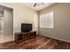 This bedroom features wood floors, plantation shutters, and ceiling fan at 2554 E Honeysuckle Pl, Chandler, AZ 85286