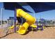 Colorful playground featuring slides, ladders, and swings under a shaded canopy at 2554 E Honeysuckle Pl, Chandler, AZ 85286