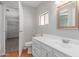 Bathroom featuring single vanity, framed mirror, and toilet at 2650 W Union Hills Dr # 269, Phoenix, AZ 85027