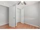 Bedroom with hardwood floor and closet with white doors at 2650 W Union Hills Dr # 269, Phoenix, AZ 85027