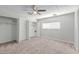 Large bedroom with a ceiling fan, neutral carpet, bright light and closet space at 2650 W Union Hills Dr # 269, Phoenix, AZ 85027