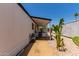 Side exterior of single-story home with desert landscaping, easy access to the covered porch, and a well-manicured lawn at 2650 W Union Hills Dr # 269, Phoenix, AZ 85027