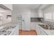 Modern kitchen with stainless steel appliances, granite countertops, hardwood floors and white cabinetry at 2650 W Union Hills Dr # 269, Phoenix, AZ 85027