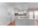 Modern kitchen with white cabinetry, an island cooktop, and sleek countertops at 2650 W Union Hills Dr # 269, Phoenix, AZ 85027