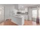 Bright kitchen with white cabinetry, granite countertops, stainless steel appliances, and hardwood flooring at 2650 W Union Hills Dr # 269, Phoenix, AZ 85027
