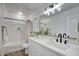 Modern bathroom featuring a white vanity, black hardware, and a tub with shower at 2676 E Mineral Park Rd, San Tan Valley, AZ 85143