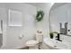 Charming half bathroom featuring a sleek black faucet and decorative mirror at 2676 E Mineral Park Rd, San Tan Valley, AZ 85143