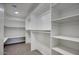 Spacious walk-in closet with ample shelving and hanging space for optimal storage at 2676 E Mineral Park Rd, San Tan Valley, AZ 85143