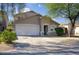 Charming one-story home featuring a stucco exterior, attached garage, and well-maintained landscaping in a desirable neighborhood at 2676 E Mineral Park Rd, San Tan Valley, AZ 85143