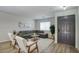 Comfortable living room featuring a gray sofa, stylish decor, wood-look floors, and an inviting atmosphere at 2676 E Mineral Park Rd, San Tan Valley, AZ 85143