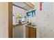 A sink and bar counter top with a plant, wood cabinets and a television screen in the background at 2956 E Sequoia Dr, Phoenix, AZ 85050