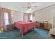 Bedroom featuring a bed with a red comforter, and a large dresser at 2956 E Sequoia Dr, Phoenix, AZ 85050