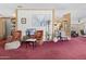 Living room featuring plush red carpet, traditional furniture, and wood accents at 2956 E Sequoia Dr, Phoenix, AZ 85050