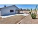 Exterior view of the home showcasing the patio, xeriscaping, and a low-maintenance backyard at 3178 W Williams Dr, Phoenix, AZ 85027