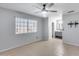 Bright bedroom with a ceiling fan and access to an en-suite bathroom at 3178 W Williams Dr, Phoenix, AZ 85027