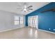 Bright bedroom features neutral walls, a ceiling fan, and natural light at 3178 W Williams Dr, Phoenix, AZ 85027