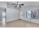 Neutral living room features tiled floors, natural light, and front door access at 3178 W Williams Dr, Phoenix, AZ 85027