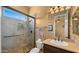 Bathroom featuring a glass enclosed walk-in shower, vanity with decorative faucet, and tile flooring at 36813 N 109Th Way, Scottsdale, AZ 85262