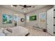 Well-lit bedroom features neutral walls, ceiling fan, and a TV on the wall at 36813 N 109Th Way, Scottsdale, AZ 85262