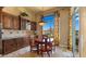 Bright dining area with built-in cabinets and stunning outdoor views at 36813 N 109Th Way, Scottsdale, AZ 85262