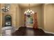 Dining room with decorative chandelier, wood floors, and large windows offering backyard views at 36813 N 109Th Way, Scottsdale, AZ 85262